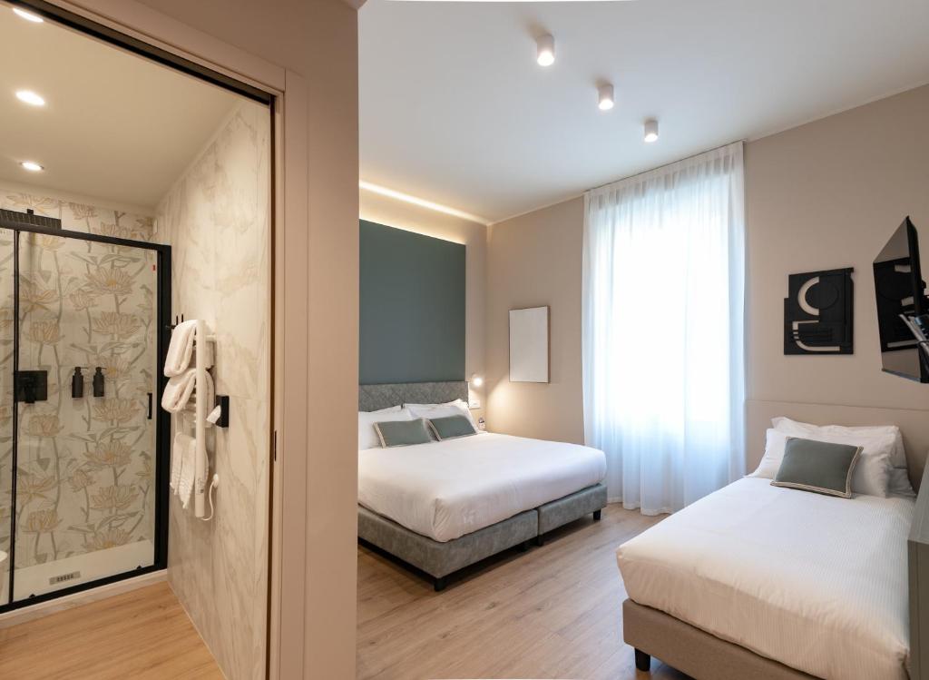 Postel nebo postele na pokoji v ubytování Aiello Hotels - Isola Design District
