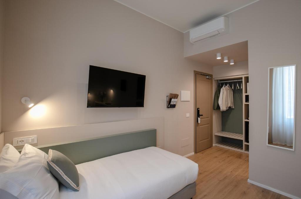 Postel nebo postele na pokoji v ubytování Aiello Hotels - Isola Design District