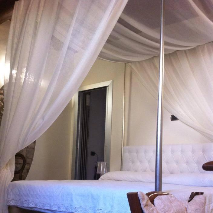 Postel nebo postele na pokoji v ubytování B&B Al Convento