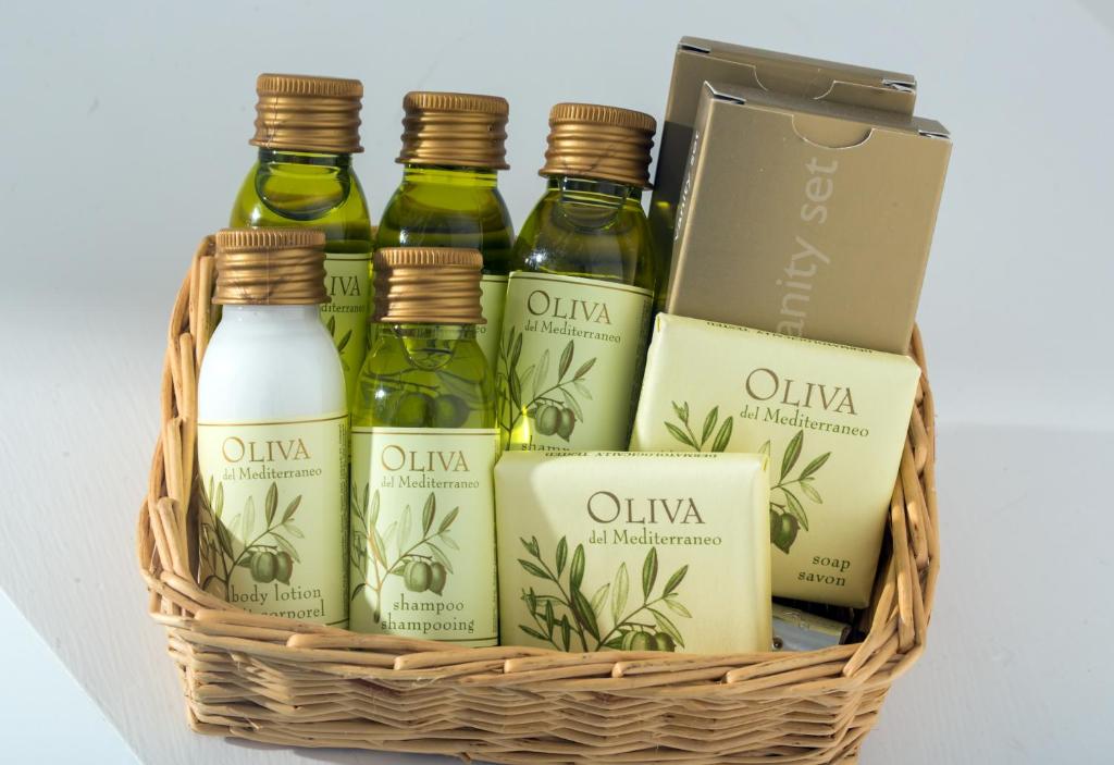a basket of olive oil and other products at Hotel Le Terrazze in Conca dei Marini
