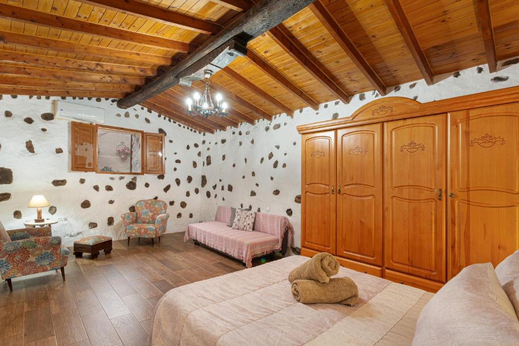 A bed or beds in a room at Casa Las Toscas