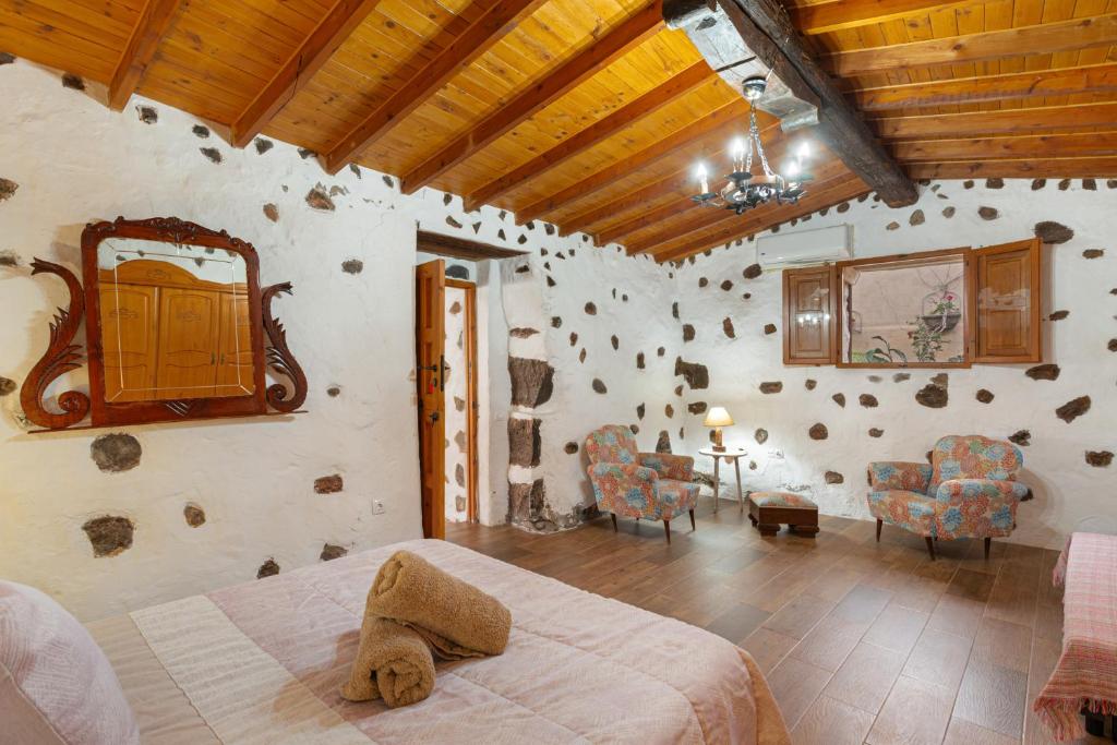 A bed or beds in a room at Casa Las Toscas
