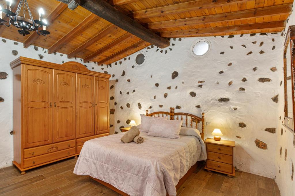 A bed or beds in a room at Casa Las Toscas