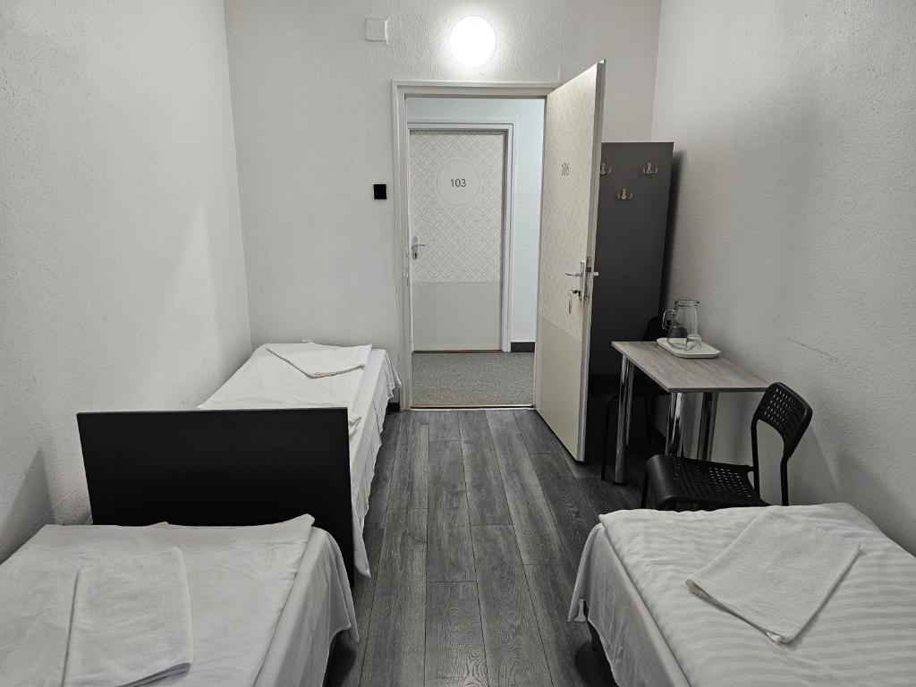 Postel nebo postele na pokoji v ubytování Dominik Panzió