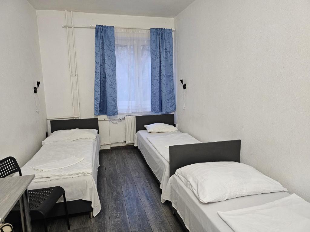 Postel nebo postele na pokoji v ubytování Dominik Panzió