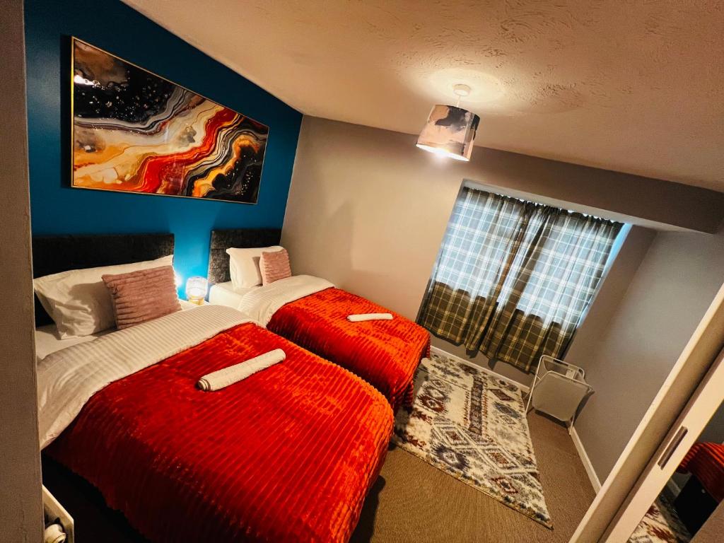 a bedroom with two beds and a window at Chic 2BR escape near Luton Airport&Train Stn, Whipsnade zoo, Contractors in Luton