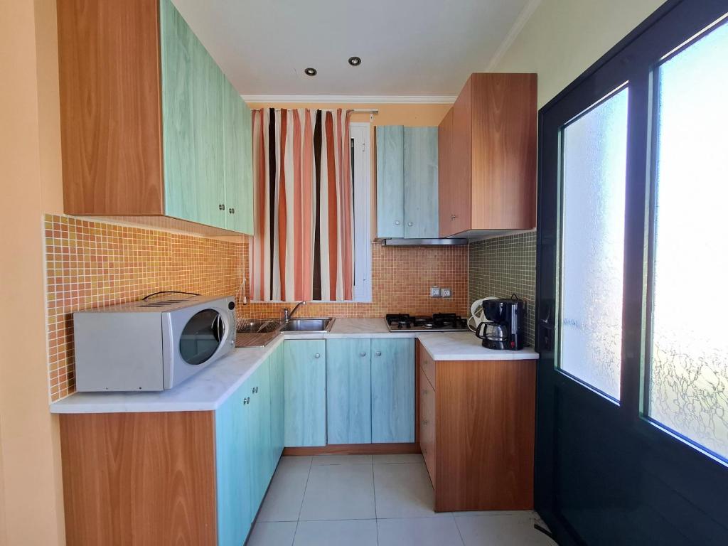 Kuchyň nebo kuchyňský kout v ubytování Sunrise Inn