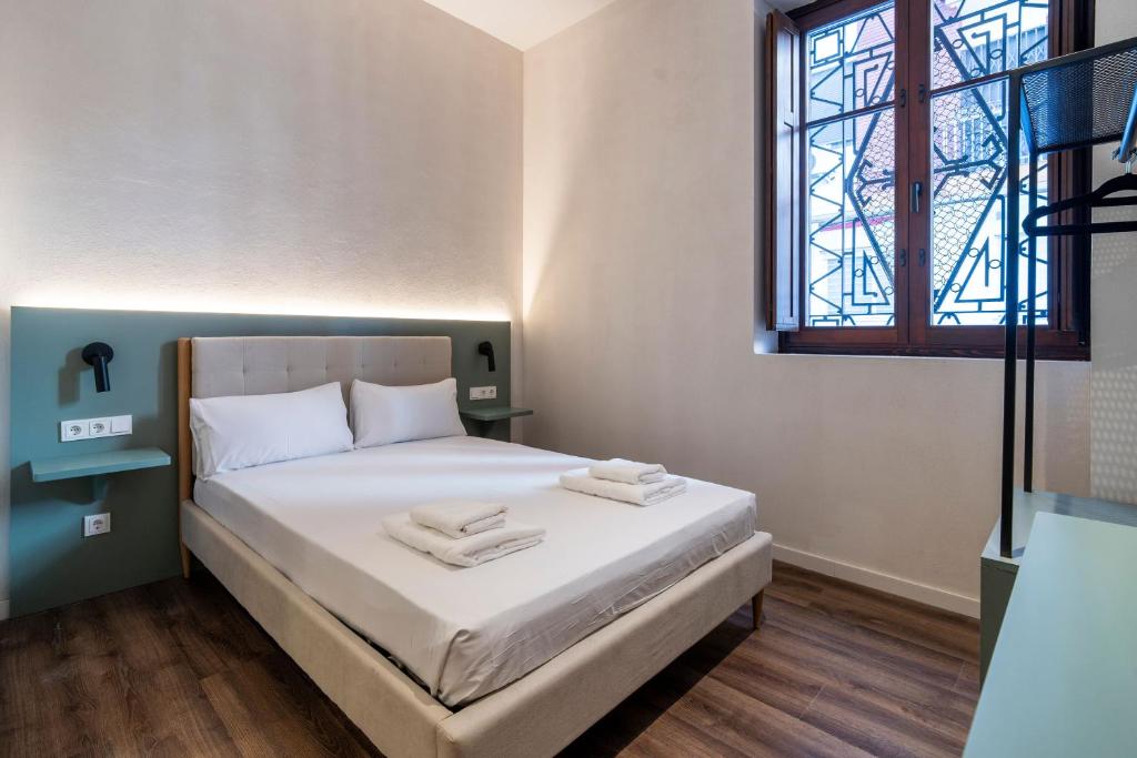 Postel nebo postele na pokoji v ubytování VLC HOST - Reina 168