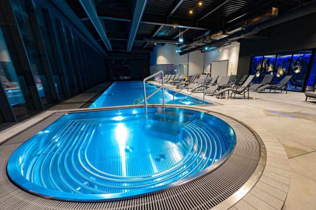 Bazén v ubytování Hotel Pestera Wellness & Spa nebo v jeho okolí