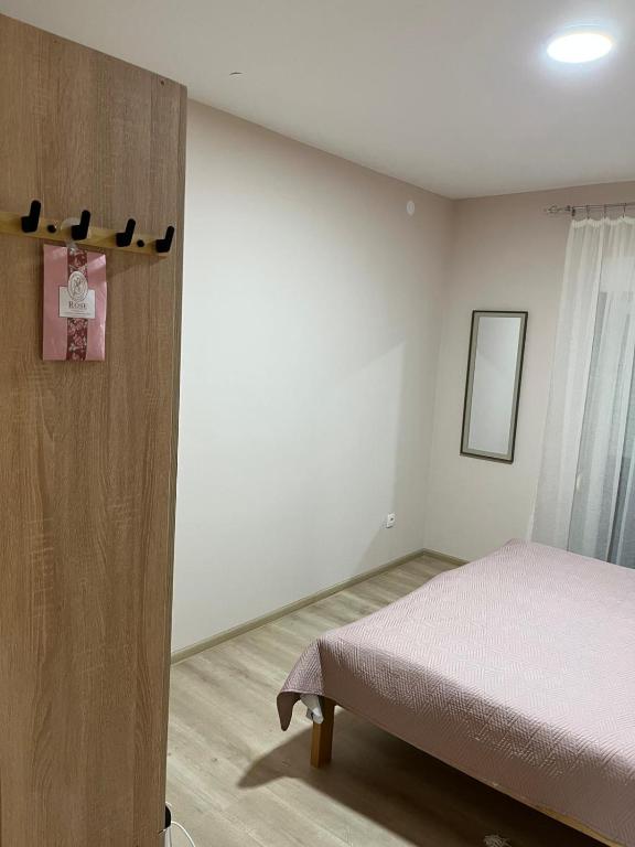Postel nebo postele na pokoji v ubytování Apartman KVINS 1