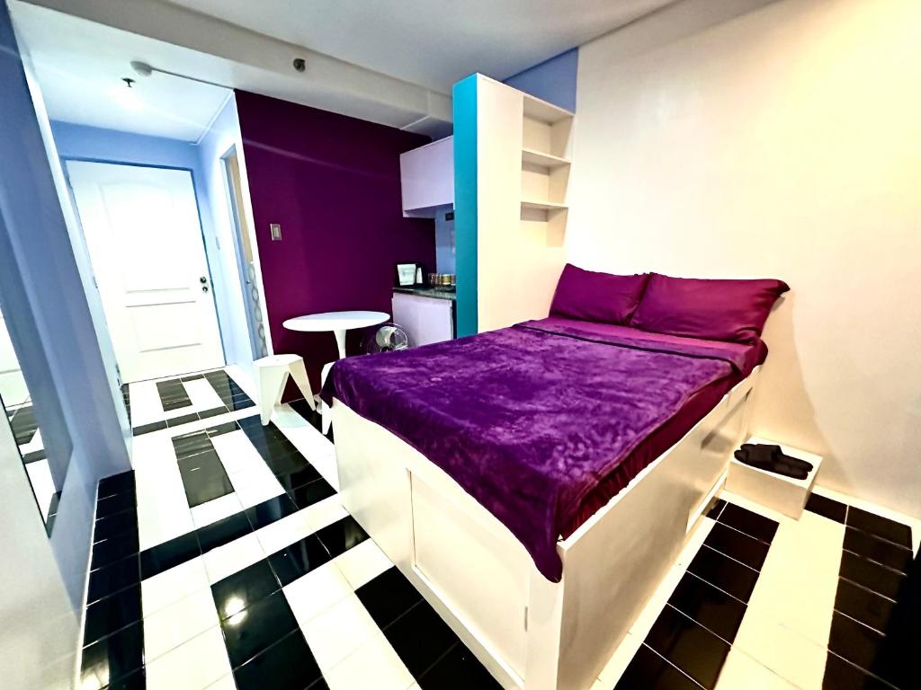 Ένα ή περισσότερα κρεβάτια σε δωμάτιο στο Baguio Equinoxx Homestay