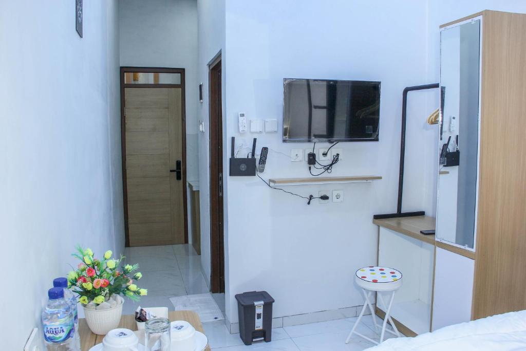 Kuchyň nebo kuchyňský kout v ubytování Laswi Syariah Guest House