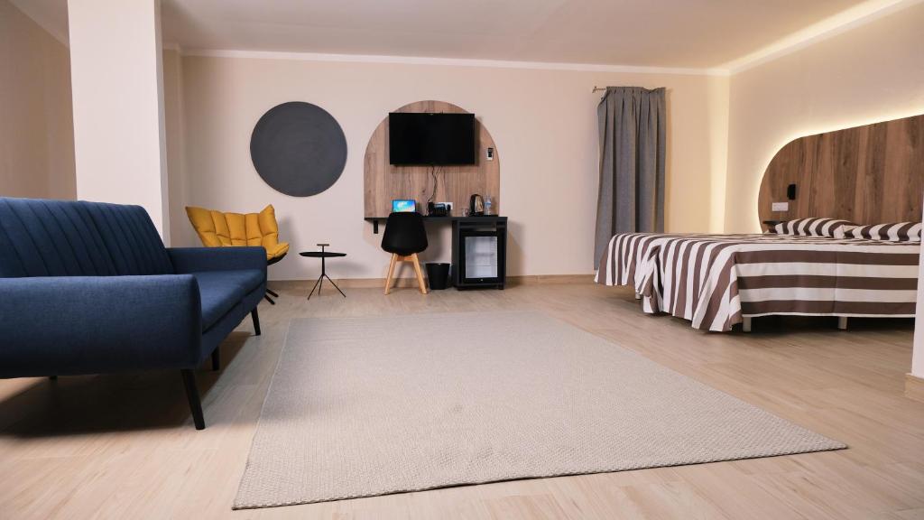 Postel nebo postele na pokoji v ubytování Hotel Aloe Emira NKC