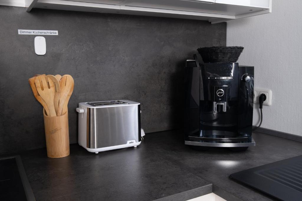 Příslušenství pro přípravu čaje a kávy v ubytování Apartment 1