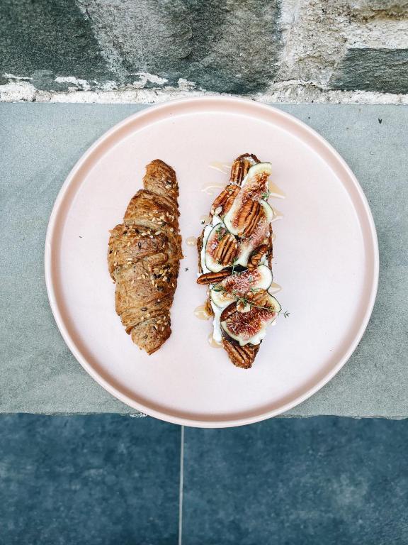 two pieces of food on a plate on a table at Locanda Il Carugio in Corniglia