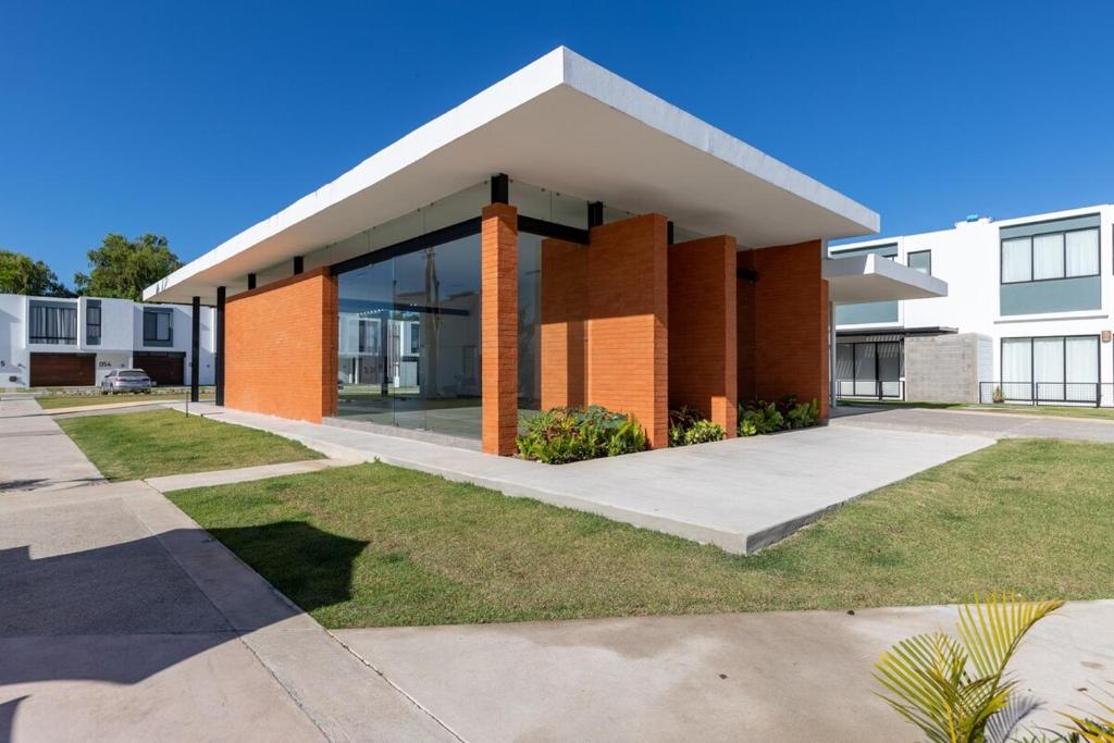 a large brick building with a large window at Ebano Residential in Las Juntas