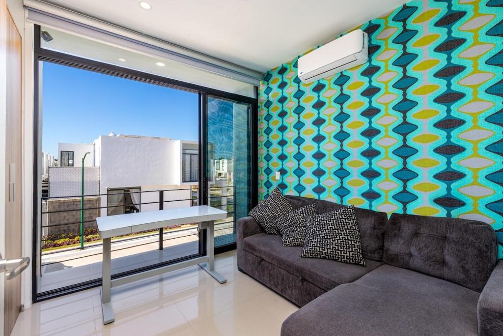a living room with a couch and a table at Ebano Residential in Las Juntas