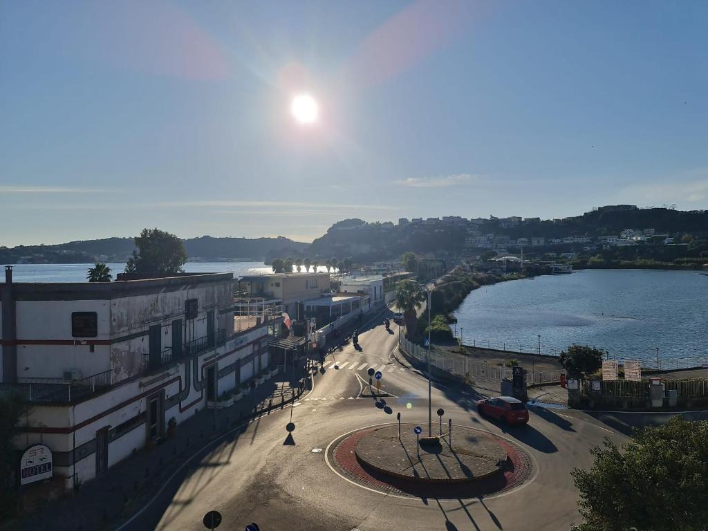 a view of a street in a town next to a body of water at Casa Gimaga in Pozzuoli