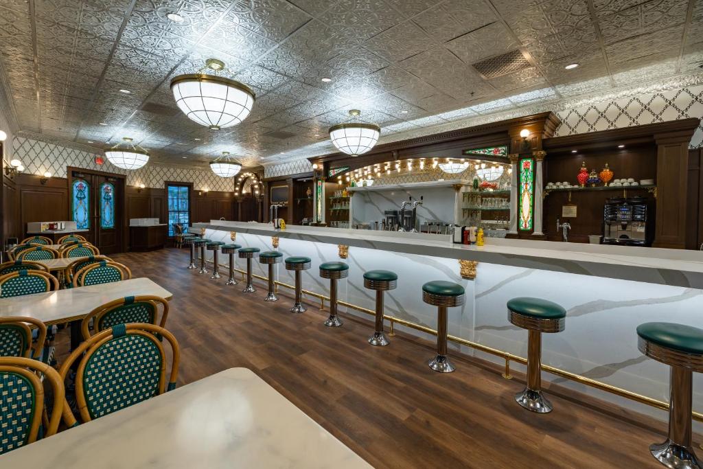 a bar with a row of stools in a restaurant at The Ranch At Death Valley in Indian Village