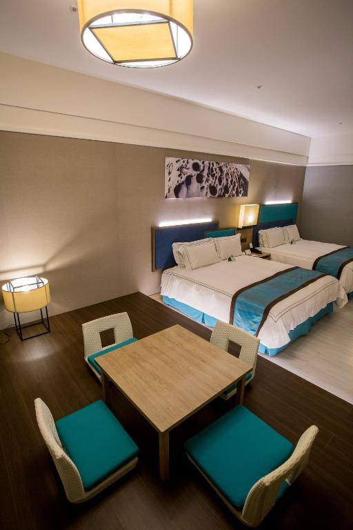 Postel nebo postele na pokoji v ubytování Fullon Hotel Fulong