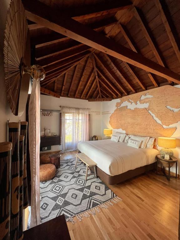a bedroom with a bed and a map on the wall at Gar Anat Hotel Boutique in Granada