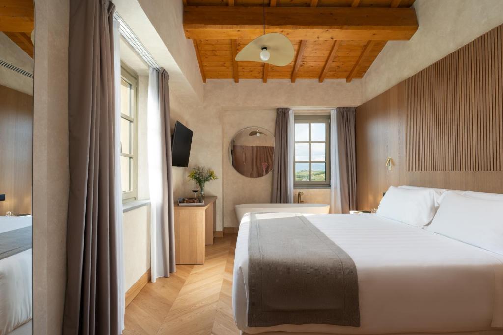 Postel nebo postele na pokoji v ubytování Villa Petriolo