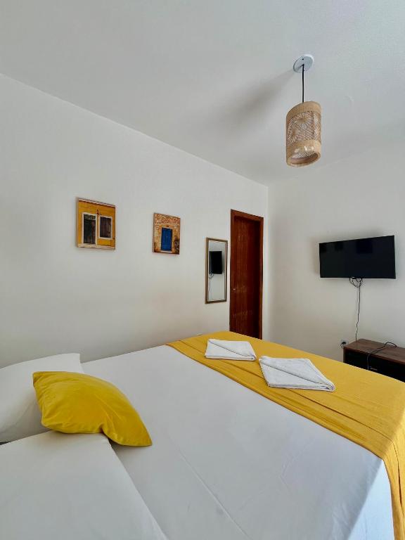 Postel nebo postele na pokoji v ubytování D'Ajuda Inn
