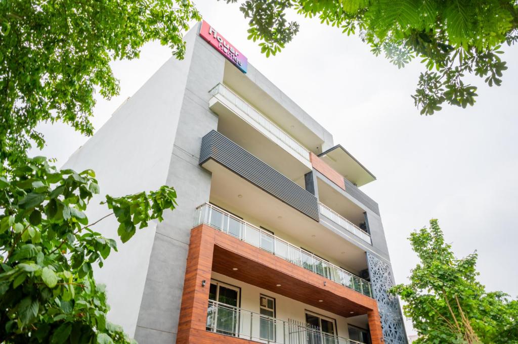 a building with trees in front of it at Housr 1RK & 1BHK Apartment Sector 28 Near Galleria Market in Gurgaon