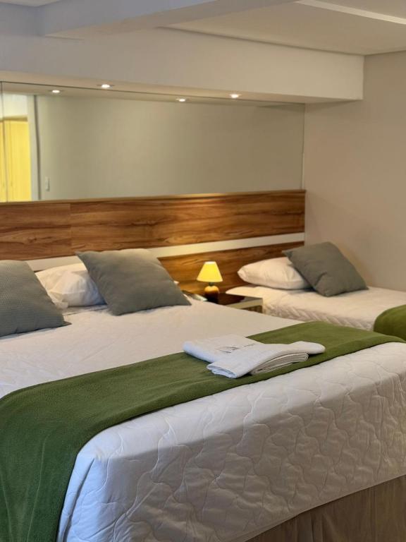 Postel nebo postele na pokoji v ubytování Hotel Imperatriz