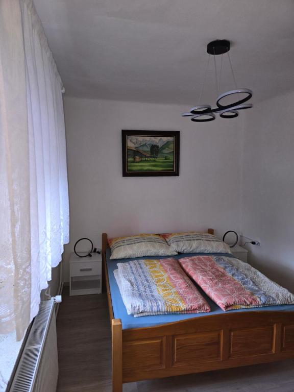 Postel nebo postele na pokoji v ubytování Apartmaji PRI JUNESKO