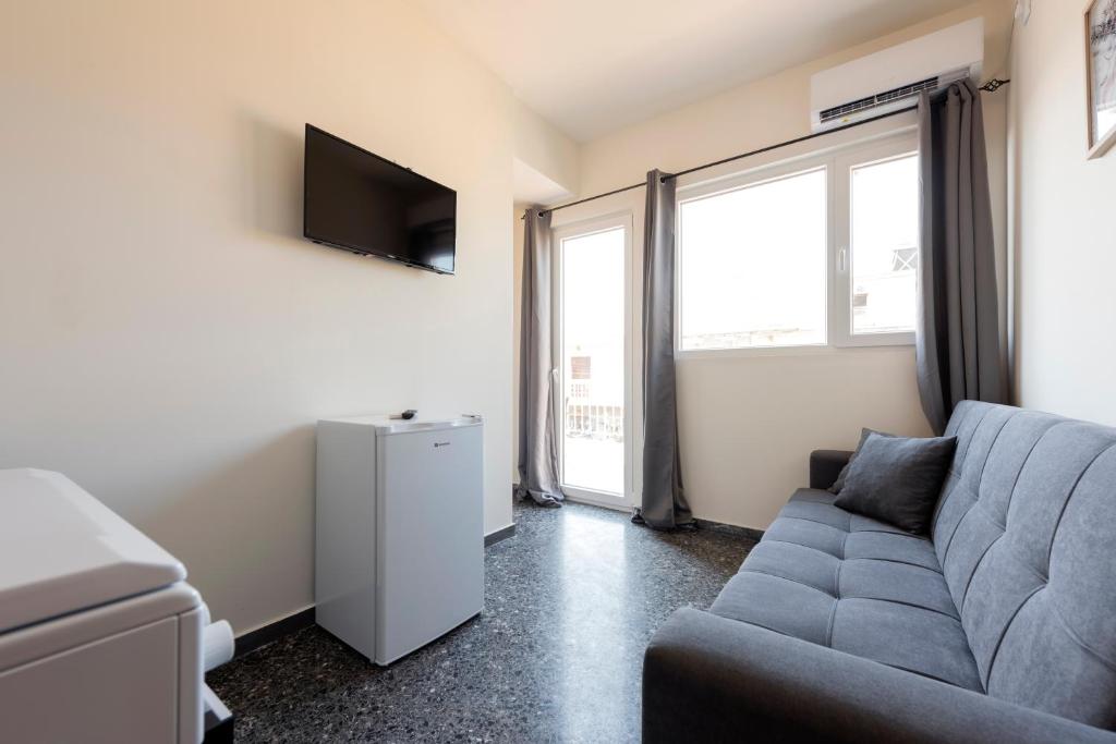 TV a/nebo společenská místnost v ubytování Liberal Mini Rooms & Suites