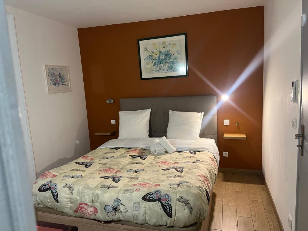 Postel nebo postele na pokoji v ubytování Le Terminus Laroche Migennes Gare
