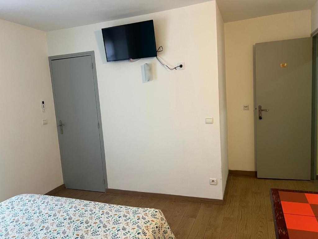 Postel nebo postele na pokoji v ubytování Le Terminus Laroche Migennes Gare