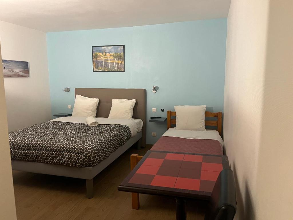 Postel nebo postele na pokoji v ubytování Le Terminus Laroche Migennes Gare