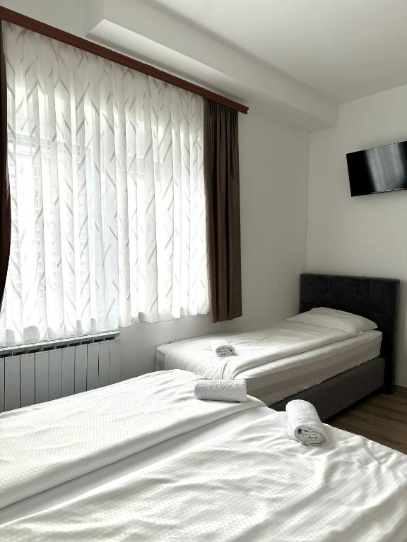 Postel nebo postele na pokoji v ubytování L&L rooms
