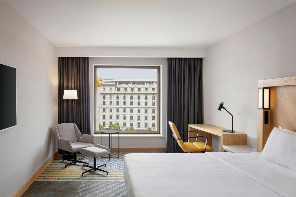 Postel nebo postele na pokoji v ubytování Courtyard by Marriott Tbilisi