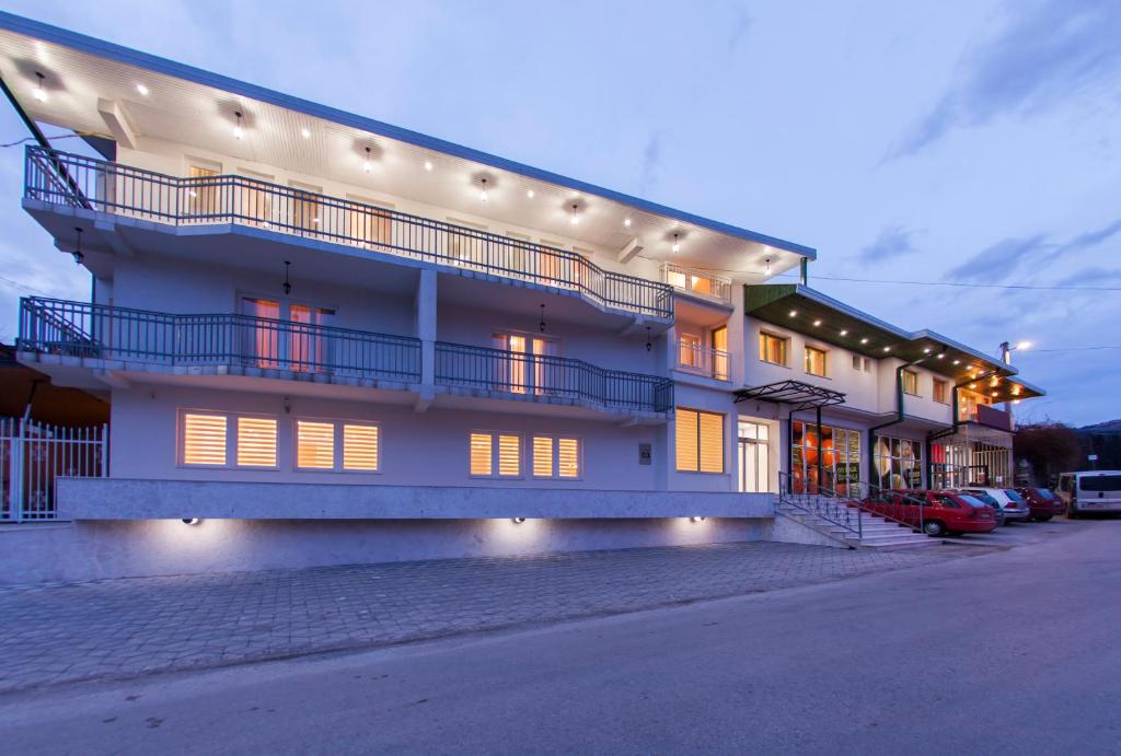 a large building with lights on the side of it at Hotel Hayat Hills in Sarajevo