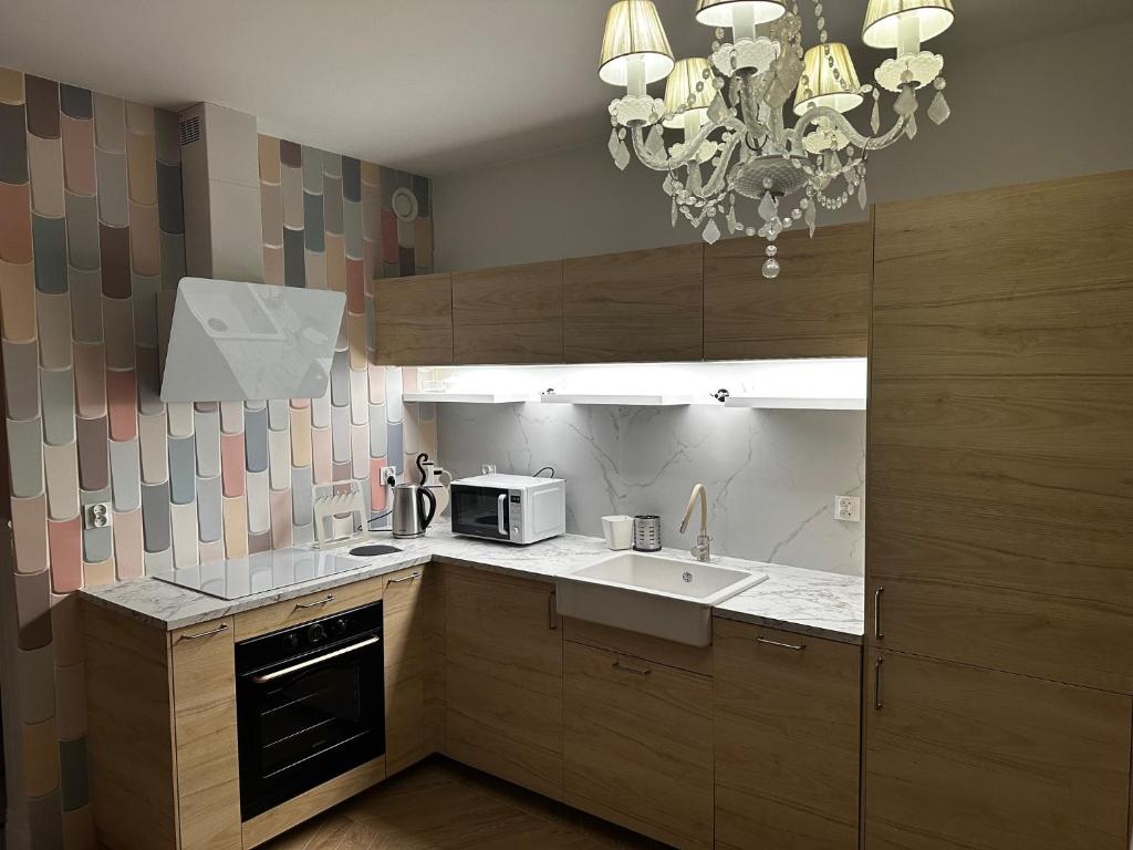 Kuchyň nebo kuchyňský kout v ubytování Apartament na Wzgórzu Piaskowy