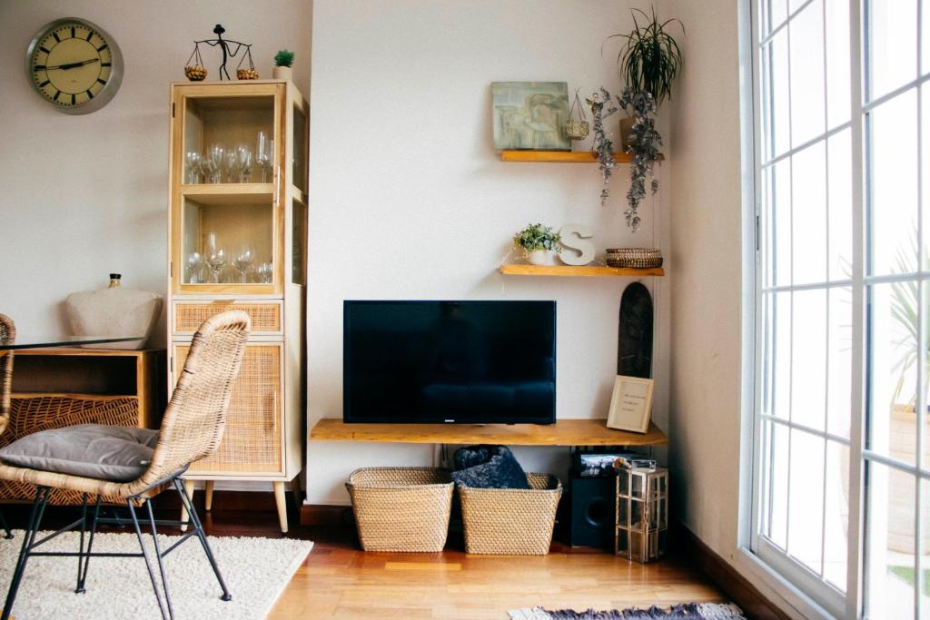 TV a/nebo společenská místnost v ubytování Apartamento Atico-Spa