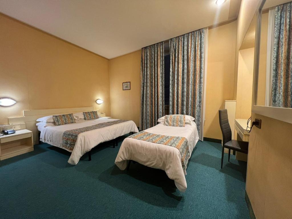 Postel nebo postele na pokoji v ubytování Hotel Patria