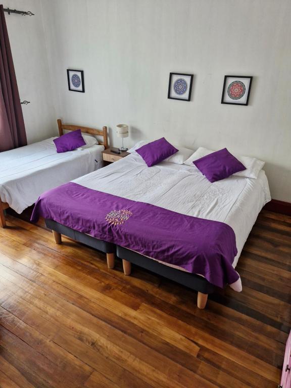 Cama o camas de una habitación en Hostal Arrayan