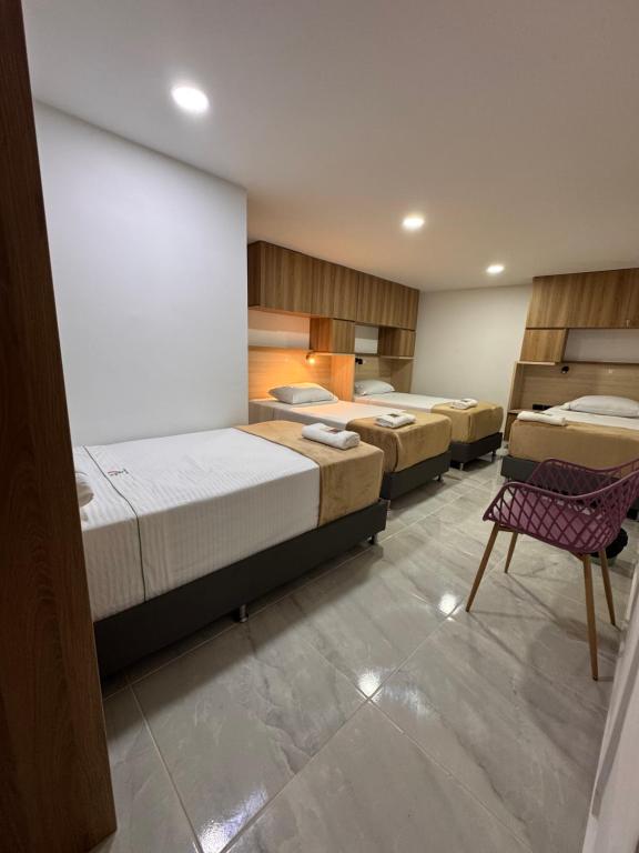 Postel nebo postele na pokoji v ubytování Vida Hostel