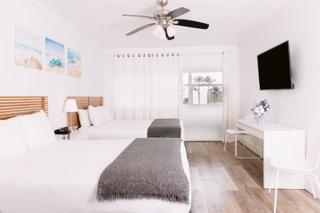Ένα ή περισσότερα κρεβάτια σε δωμάτιο στο Lorraine Hotel