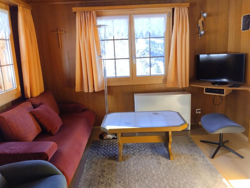 TV a/nebo společenská místnost v ubytování Chalet Gärlich