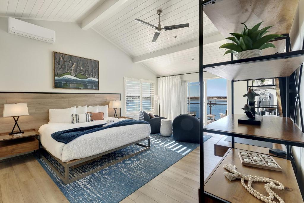 a bedroom with a king sized bed and a desk at Anderson Inn in Morro Bay