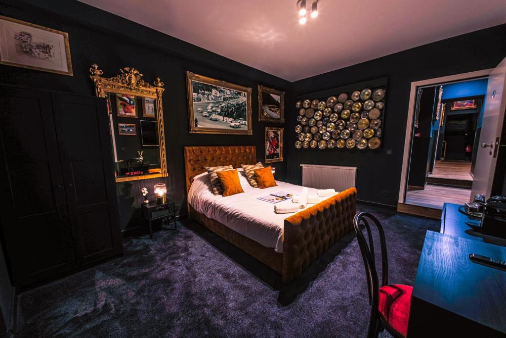Postel nebo postele na pokoji v ubytování Hôtel Palmarès