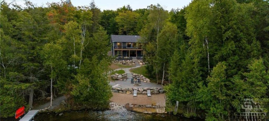 an aerial view of a large house in the woods at Algonquin Park,Sunset Paradise with Private Beach in Madawaska