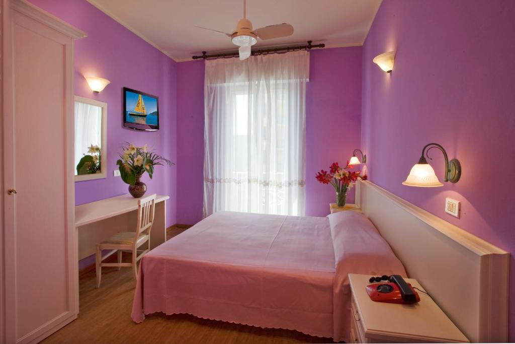 Postel nebo postele na pokoji v ubytování Hotel Plaza