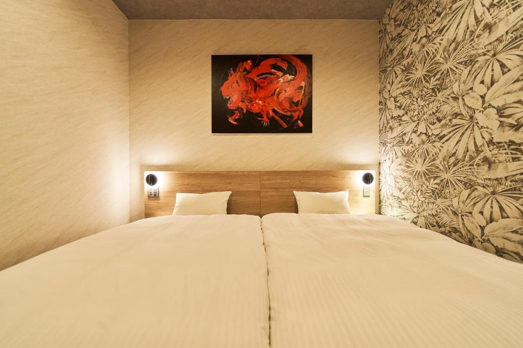 Postel nebo postele na pokoji v ubytování Katsuyama New Hotel