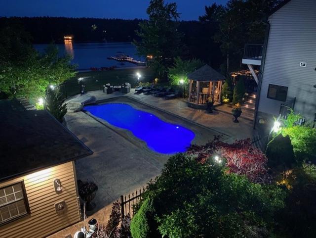 an overhead view of a swimming pool in a backyard at night at Long Lake Escape in Hammonds Plains